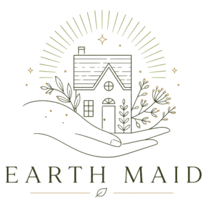 Gold line art of a small house inside a radiant circular backdrop with plants and star-like accents, containing the text 'EARTHM' at the bottom.