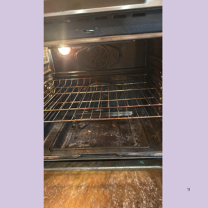 Interior of a home oven with a metal wire rack, dirty bottom, and a small light on the left; oven appears used and unclean inside.
