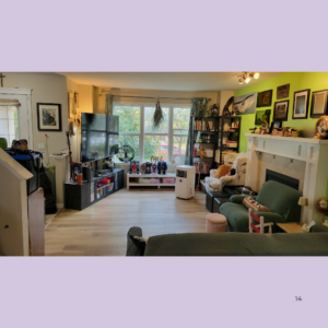Cozy living room with a bright green accent wall, fireplace, and a large window; toys and books on shelves, TV unit along the wall, and seating nearby.